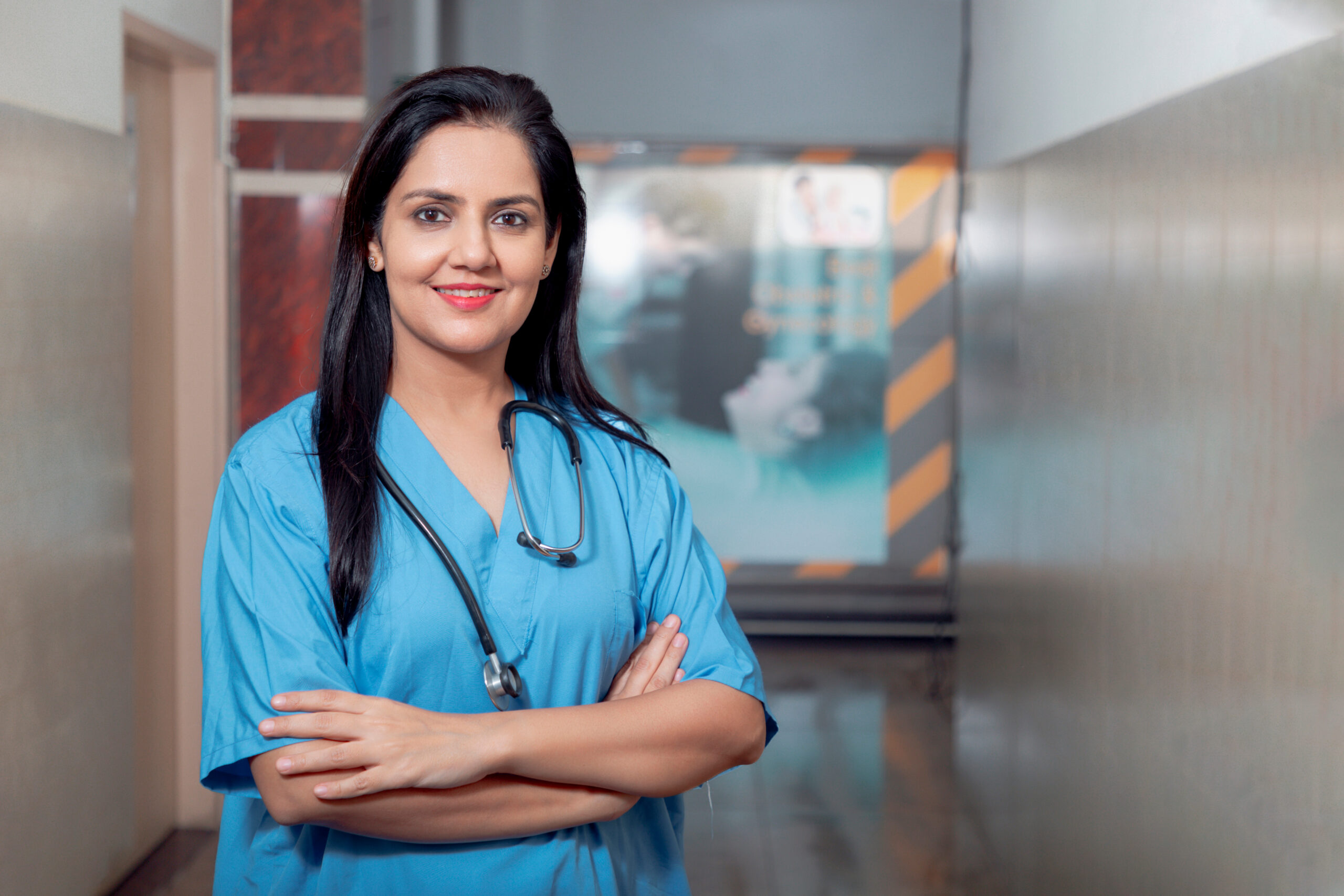 Medical concept, Indian female doctor in uniform standing at hospital.